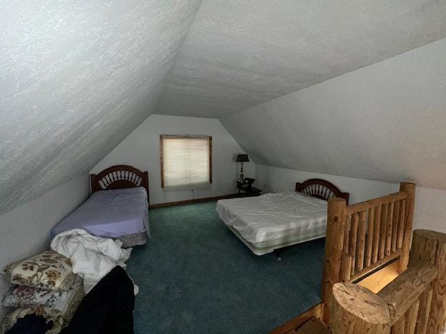 3786 W Houghton Lake Dr, Houghton Lake, MI 48629 - bedroom featuring lofted ceiling, a textured ceiling, and carpet