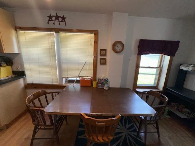 3786 W Houghton Lake Dr, Houghton Lake, MI 48629 - dining area with light wood-style flooring