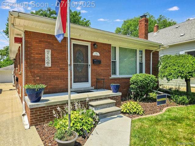 144 1st St, Wyandotte, MI 48192 - ranch-style house featuring brick siding and a chimney