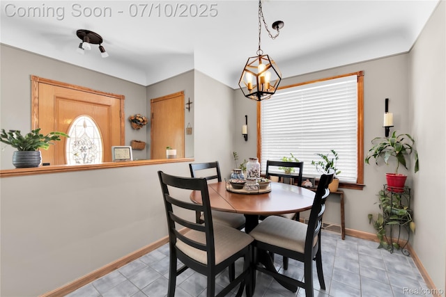 144 1st St, Wyandotte, MI 48192 - dining room featuring a chandelier and light tile patterned floors