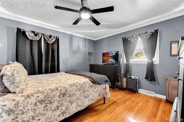 144 1st St, Wyandotte, MI 48192 - bedroom featuring wood finished floors, ceiling fan, and crown molding