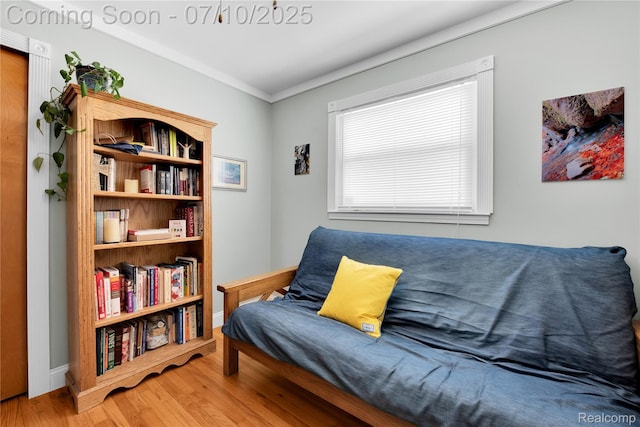 144 1st St, Wyandotte, MI 48192 - sitting room featuring wood finished floors and ornamental molding