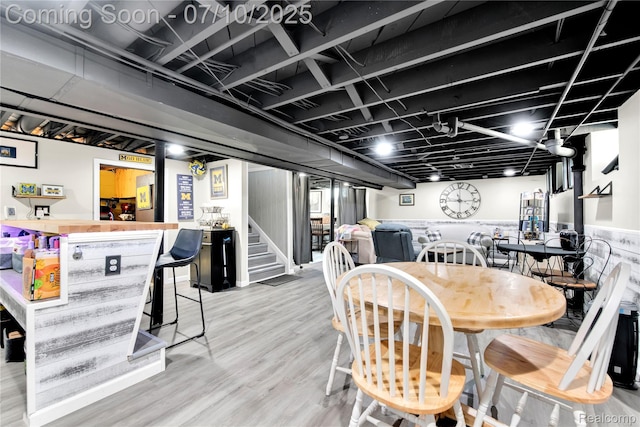 144 1st St, Wyandotte, MI 48192 - dining area featuring stairs, wood finished floors, and bar area