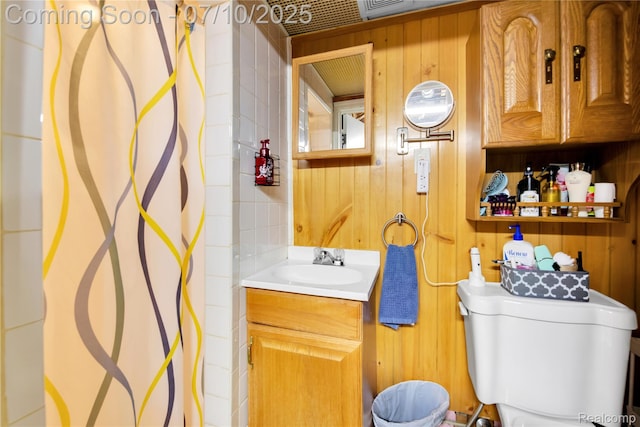 144 1st St, Wyandotte, MI 48192 - full bathroom featuring vanity, a shower with shower curtain, and wood walls