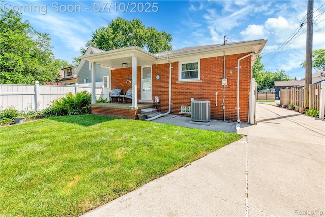 144 1st St, Wyandotte, MI 48192 - back of house with covered porch and brick siding