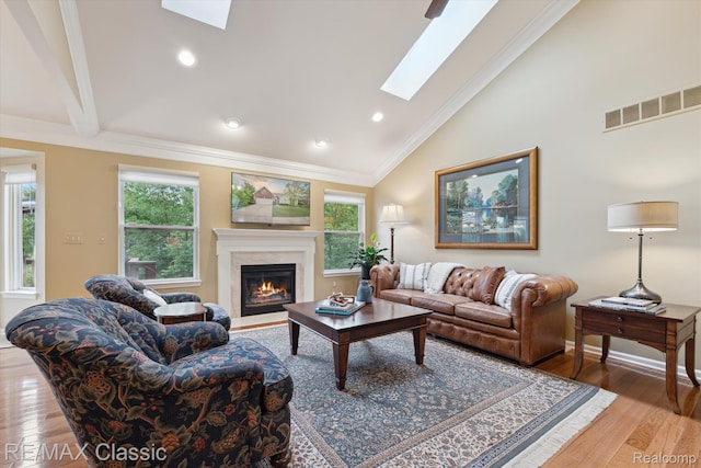 30166 Brightwood Dr Unit 40, Novi, MI 48377 - living area with a skylight, wood finished floors, a premium fireplace, recessed lighting, and ornamental molding