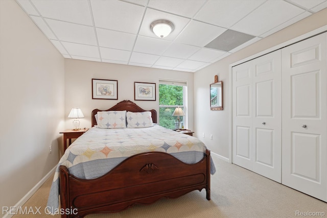 30166 Brightwood Dr Unit 40, Novi, MI 48377 - bedroom with light colored carpet, a paneled ceiling, and a closet