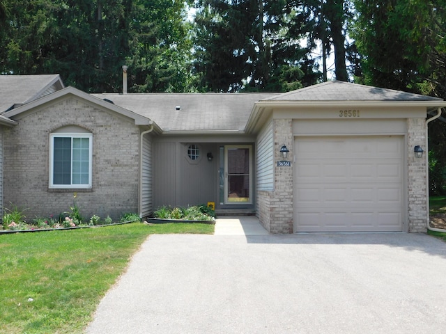 36561 S Deerhurst S, Westland, MI 48185 - single story home featuring brick siding, an attached garage, driveway, and roof with shingles
