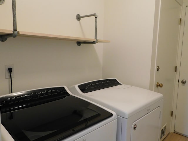 36561 S Deerhurst S, Westland, MI 48185 - laundry area featuring washer and clothes dryer and light wood-style floors