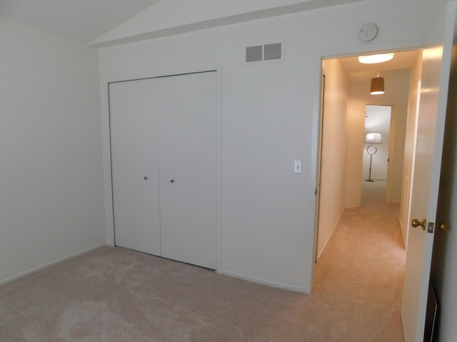 36561 S Deerhurst S, Westland, MI 48185 - unfurnished bedroom with light colored carpet, a closet, and vaulted ceiling