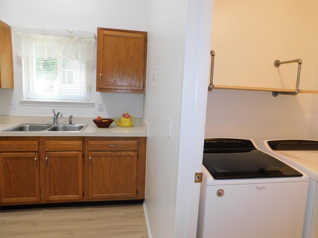 36561 S Deerhurst S, Westland, MI 48185 - kitchen featuring washer and dryer, light countertops, brown cabinets, and light wood finished floors