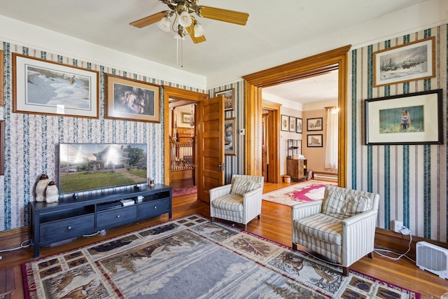 501 E Michigan Ave, Marshall, MI 49068 - living area featuring wallpapered walls, wood finished floors, and a ceiling fan