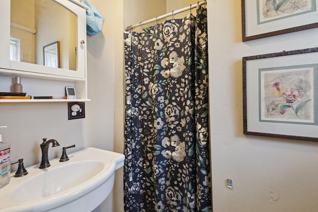 501 E Michigan Ave, Marshall, MI 49068 - full bathroom featuring a sink and a shower with shower curtain
