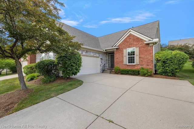 838 Knolls Landing Dr Unit 6, Milford, MI 48381 - view of front facade with concrete driveway, an attached garage, brick siding, and a shingled roof