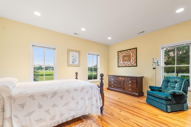 14091 Scio Church Rd, Chelsea, MI 48118 - bedroom featuring light wood-style flooring, multiple windows, and recessed lighting