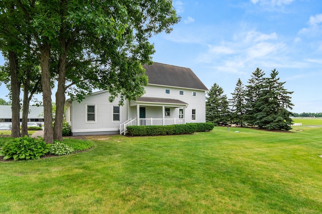 14091 Scio Church Rd, Chelsea, MI 48118 - rear view of property with a yard and covered porch