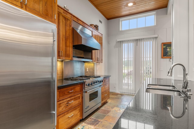 14091 Scio Church Rd, Chelsea, MI 48118 - kitchen with high end appliances, wall chimney exhaust hood, wood ceiling, brown cabinetry, and recessed lighting