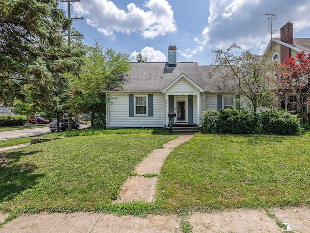 476 Borgess Ave, Monroe, MI 48162 - view of front of property featuring a chimney, a front yard, and roof with shingles