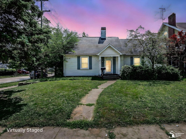 476 Borgess Ave, Monroe, MI 48162 - view of front of property featuring a chimney and a front yard