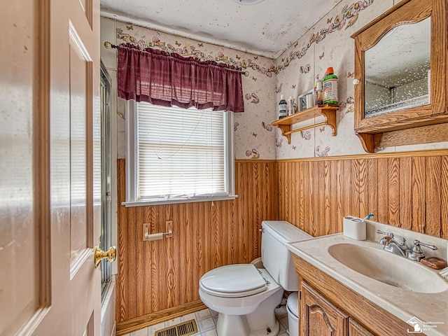 476 Borgess Ave, Monroe, MI 48162 - bathroom featuring wallpapered walls, wainscoting, vanity, and wooden walls