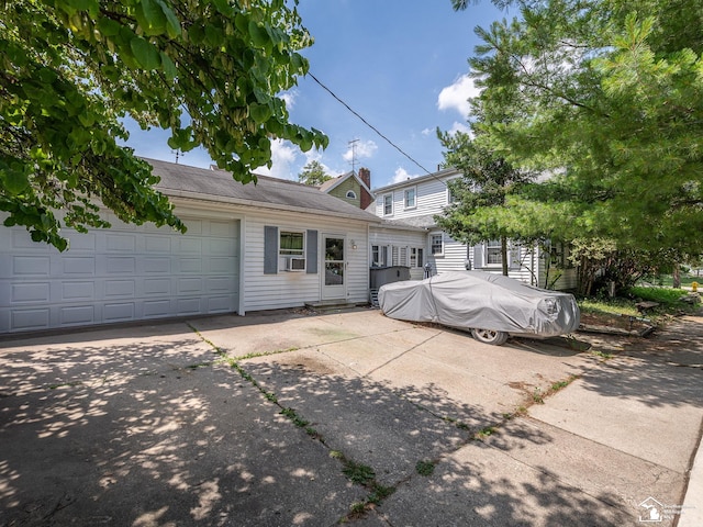 476 Borgess Ave, Monroe, MI 48162 - view of front of home featuring an attached garage, driveway, and cooling unit