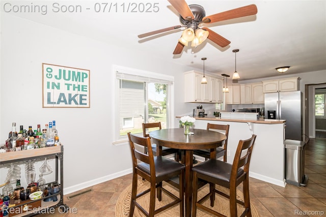 8856 Charbane Ave, White Lake, MI 48386 - dining room with a ceiling fan and baseboards