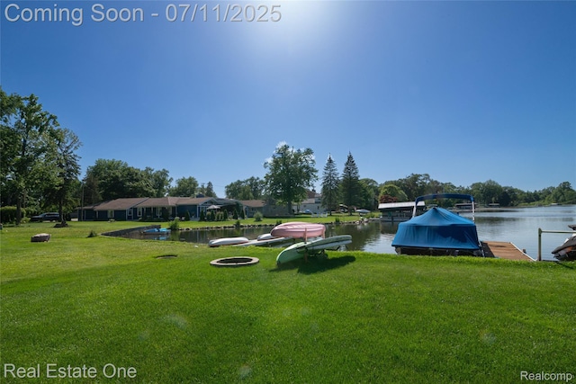 8856 Charbane Ave, White Lake, MI 48386 - view of property's community featuring a yard, a water view, and a boat dock