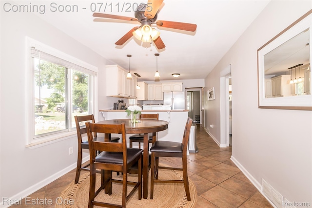 8856 Charbane Ave, White Lake, MI 48386 - dining area with ceiling fan and light tile patterned floors