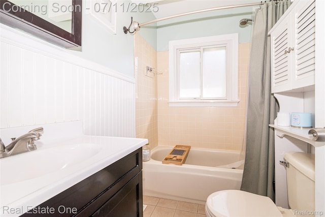 8856 Charbane Ave, White Lake, MI 48386 - full bathroom with shower / bath combo with shower curtain, vanity, tile patterned floors, and a wainscoted wall