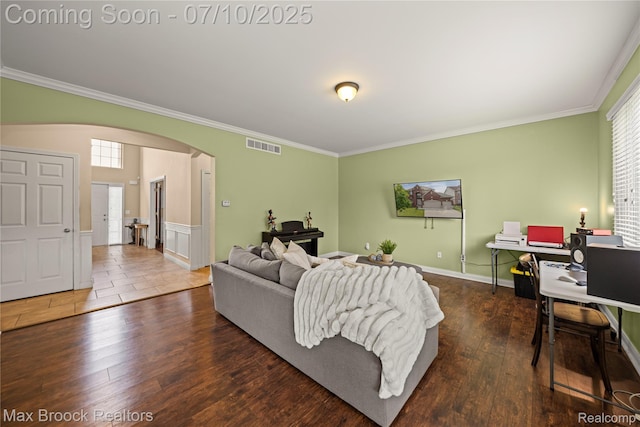 5142 Trailwood Ln, Warren, MI 48092 - living room featuring arched walkways, ornamental molding, healthy amount of natural light, and wood finished floors