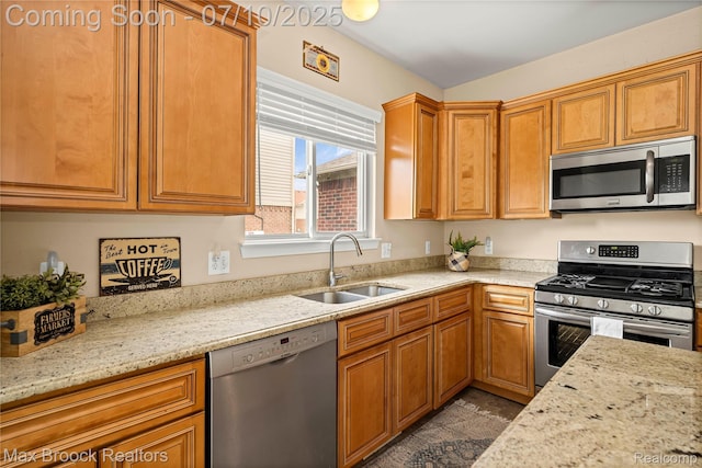5142 Trailwood Ln, Warren, MI 48092 - kitchen featuring stainless steel appliances, light stone counters, and brown cabinetry