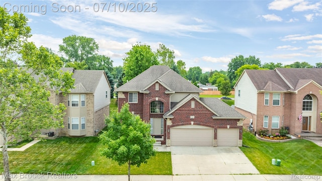 5142 Trailwood Ln, Warren, MI 48092 - traditional home featuring a garage, driveway, a front yard, and brick siding