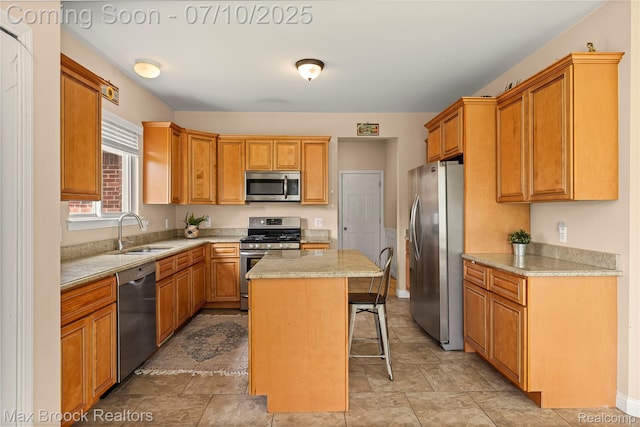 5142 Trailwood Ln, Warren, MI 48092 - kitchen with stainless steel appliances, a kitchen breakfast bar, light countertops, and a center island