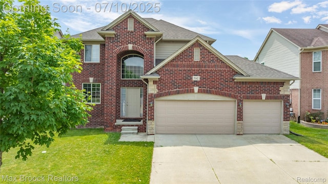 5142 Trailwood Ln, Warren, MI 48092 - traditional-style house with a front yard, concrete driveway, a garage, and brick siding