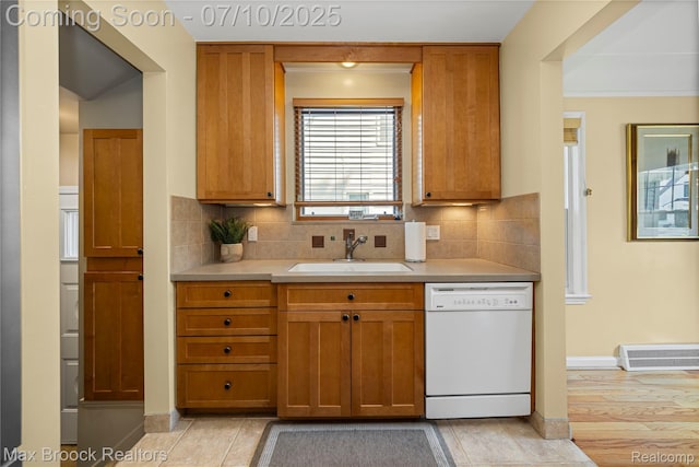 903 Oakridge Ave, Royal Oak, MI 48067 - kitchen featuring dishwasher, light countertops, tasteful backsplash, and brown cabinets