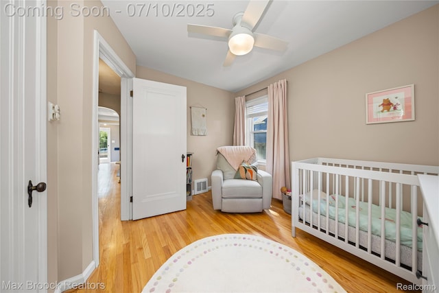 903 Oakridge Ave, Royal Oak, MI 48067 - bedroom featuring wood finished floors, a crib, and ceiling fan