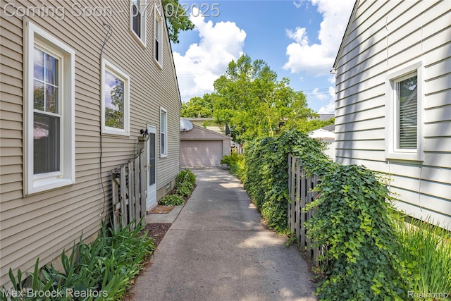903 Oakridge Ave, Royal Oak, MI 48067 - view of side of home with a detached garage and an outdoor structure