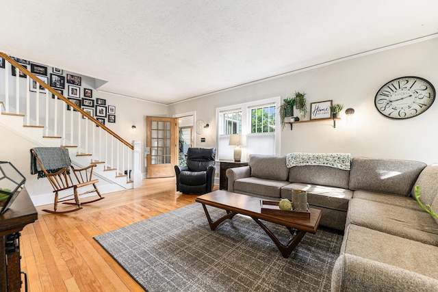 411 Edgemoor Ave, Kalamazoo, MI 49001 - living area featuring stairs, hardwood / wood-style flooring, and a textured ceiling