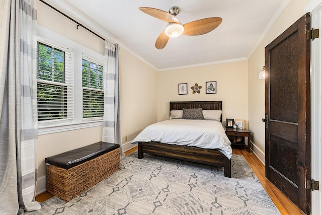 411 Edgemoor Ave, Kalamazoo, MI 49001 - bedroom featuring wood finished floors, crown molding, and a ceiling fan