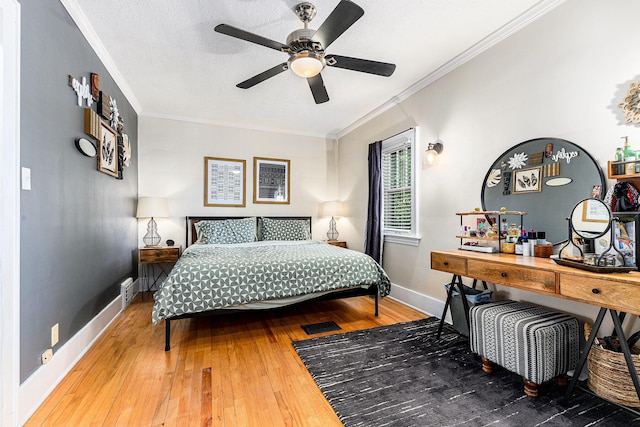 411 Edgemoor Ave, Kalamazoo, MI 49001 - bedroom with ornamental molding, hardwood / wood-style flooring, and a ceiling fan