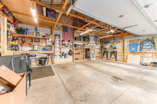 411 Edgemoor Ave, Kalamazoo, MI 49001 - garage with a workshop area and a garage door opener