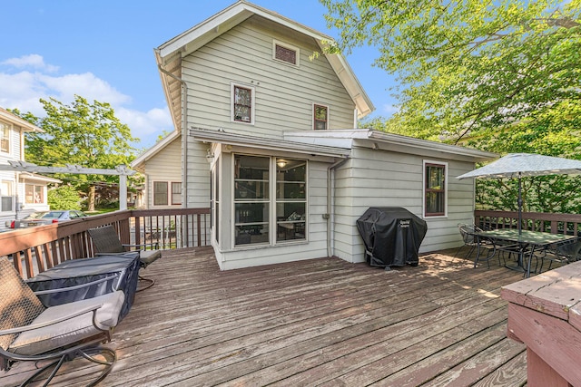 411 Edgemoor Ave, Kalamazoo, MI 49001 - wooden terrace with area for grilling and outdoor dining area