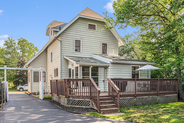 411 Edgemoor Ave, Kalamazoo, MI 49001 - back of house with a wooden deck and roof with shingles