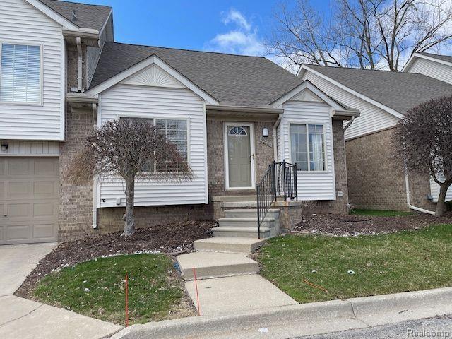 30885 Lee Frank Ln, Madison Heights, MI 48071 - split level home with an attached garage and a shingled roof