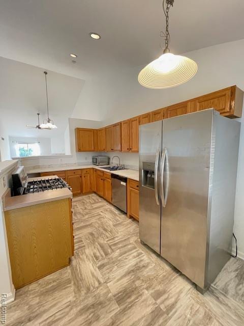 30885 Lee Frank Ln, Madison Heights, MI 48071 - kitchen with stainless steel appliances, light countertops, decorative light fixtures, brown cabinetry, and lofted ceiling