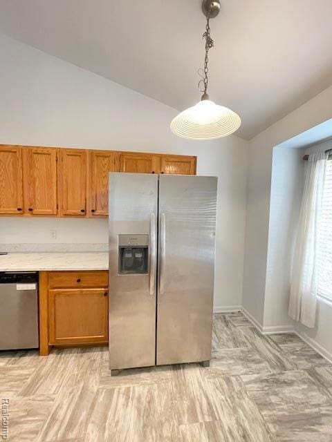 30885 Lee Frank Ln, Madison Heights, MI 48071 - kitchen with appliances with stainless steel finishes, vaulted ceiling, light countertops, brown cabinets, and decorative light fixtures
