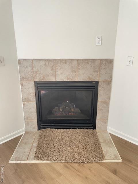 30885 Lee Frank Ln, Madison Heights, MI 48071 - detailed view of a fireplace and wood finished floors