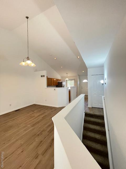 30885 Lee Frank Ln, Madison Heights, MI 48071 - stairway with wood finished floors, recessed lighting, and lofted ceiling