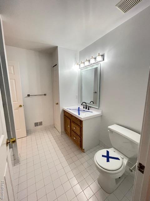 30885 Lee Frank Ln, Madison Heights, MI 48071 - half bathroom featuring vanity and tile patterned flooring