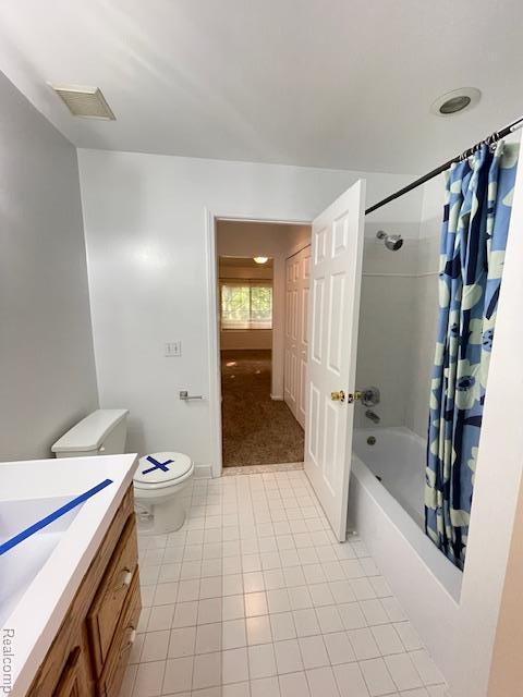30885 Lee Frank Ln, Madison Heights, MI 48071 - bathroom featuring vanity, tile patterned flooring, and shower / bathtub combination with curtain